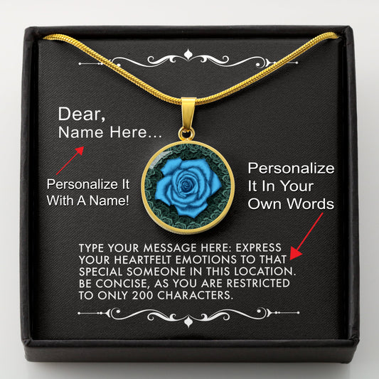 Gold necklace with a blue rose pendant in a box with a message card that can be personalized.