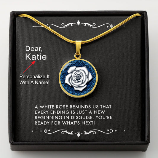 Gold necklace with a white rose pendant in a box with a message card that can be personalized.