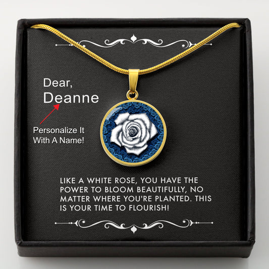 Gold necklace with a white rose pendant in a box with a message card that can be personalized.