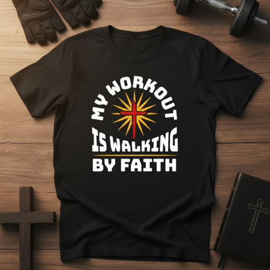 Black t-shirt with 'My workout is walking by faith' design on a wooden surface with gym equipment.