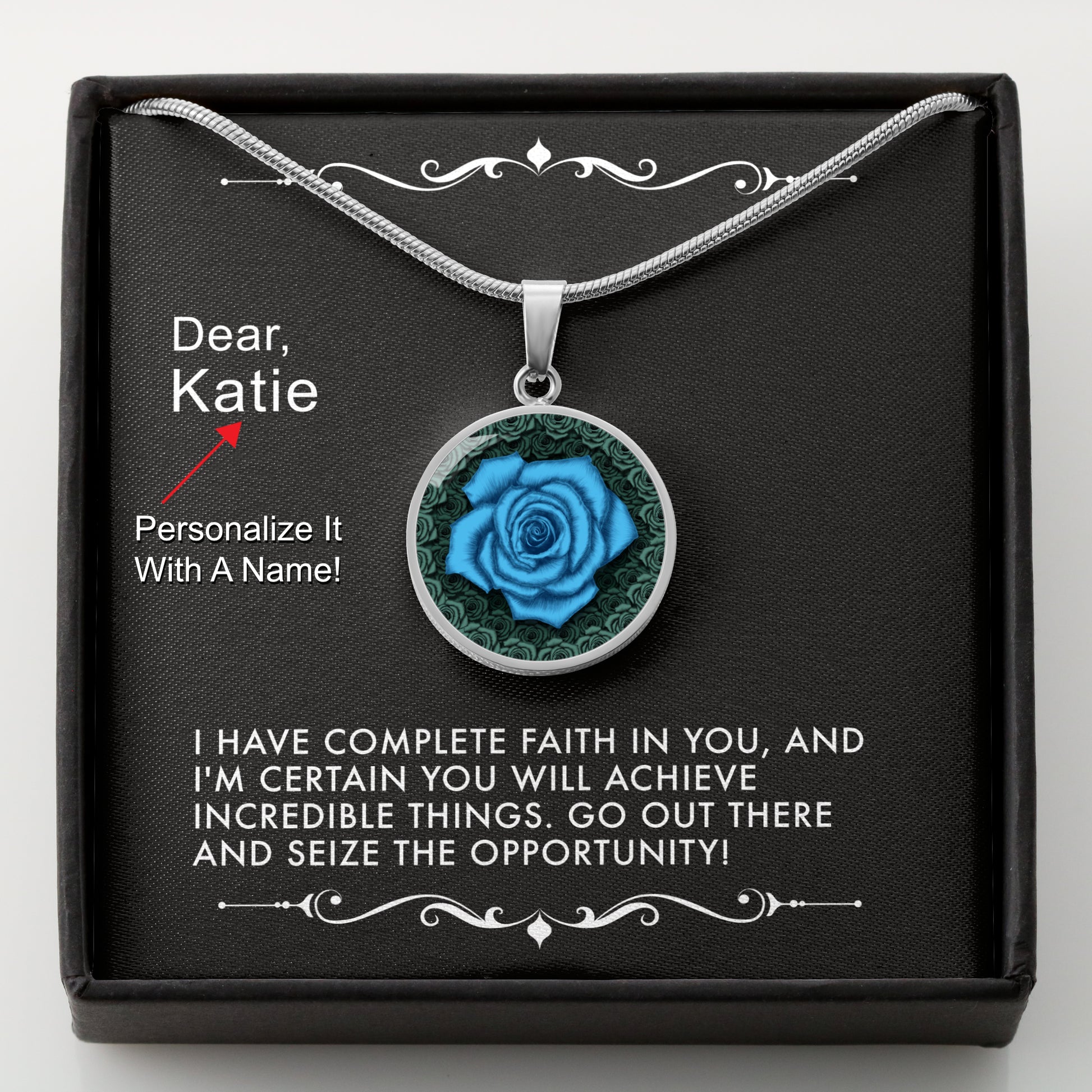 Silver necklace with a blue rose pendant in a box with a message card that can be personalized.