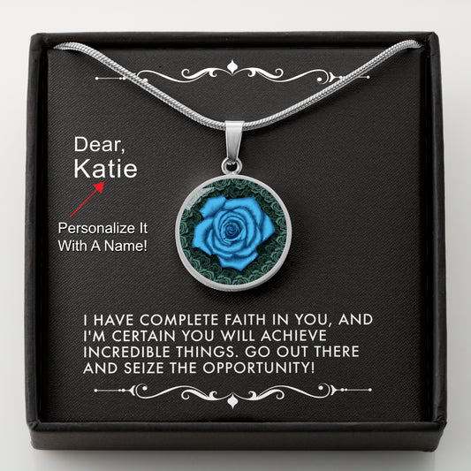 Silver necklace with a blue rose pendant in a box with a message card that can be personalized.