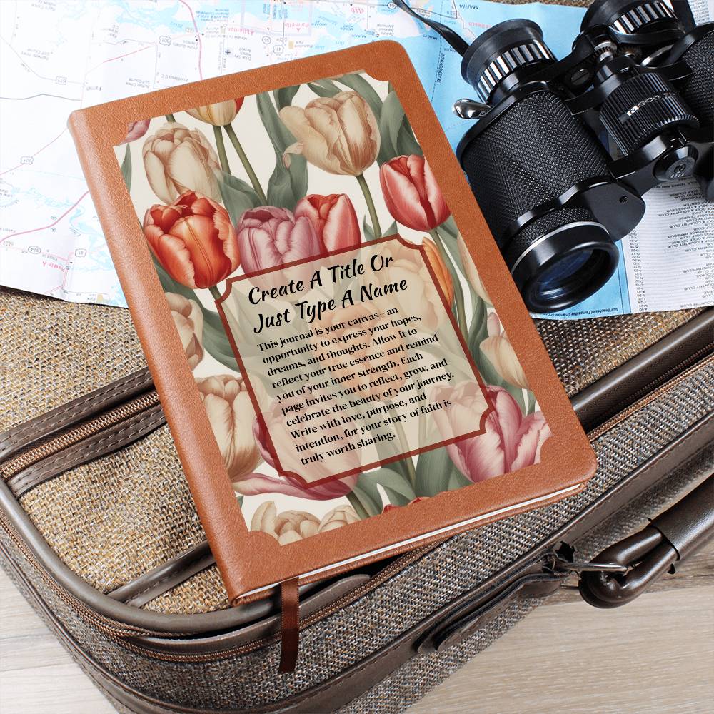 Vegan leather journal with a floral design on the cover, featuring text, red-orange, and pink tulips.