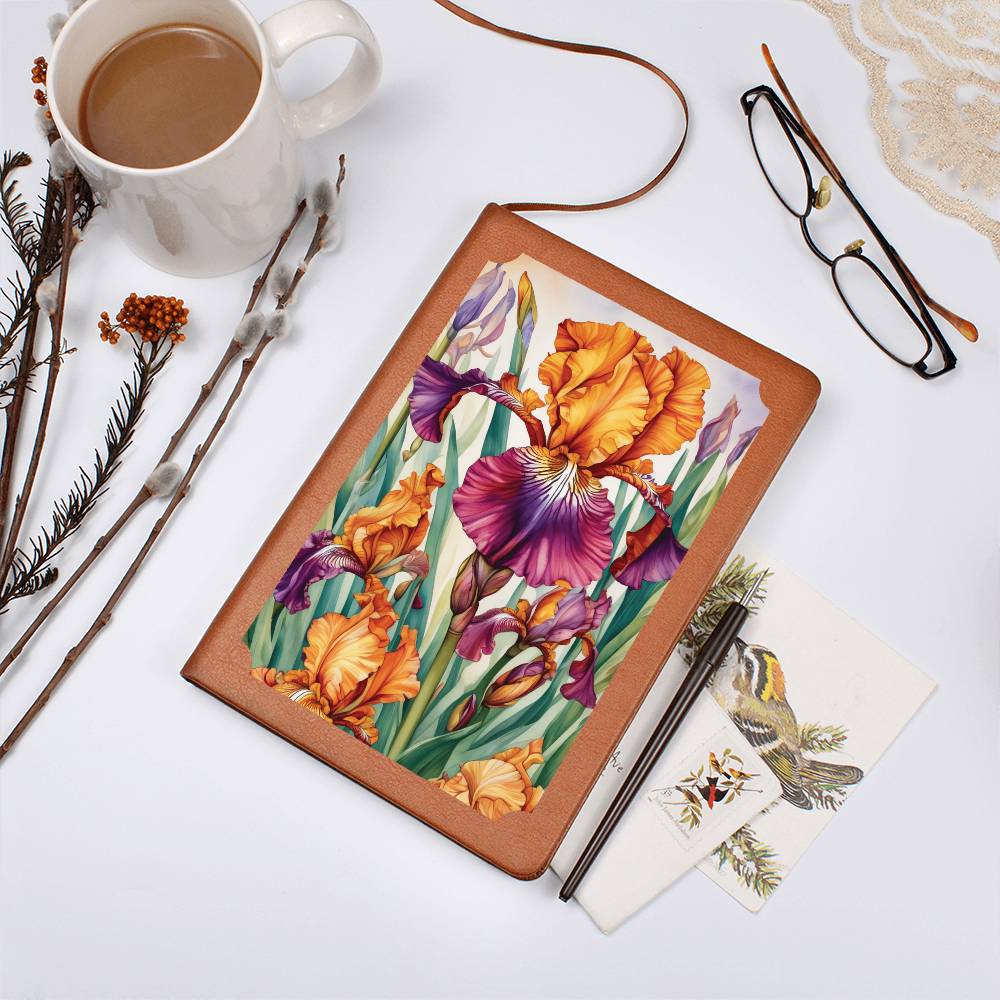 Notebook with a floral design on the cover, featuring orange and purple irises.