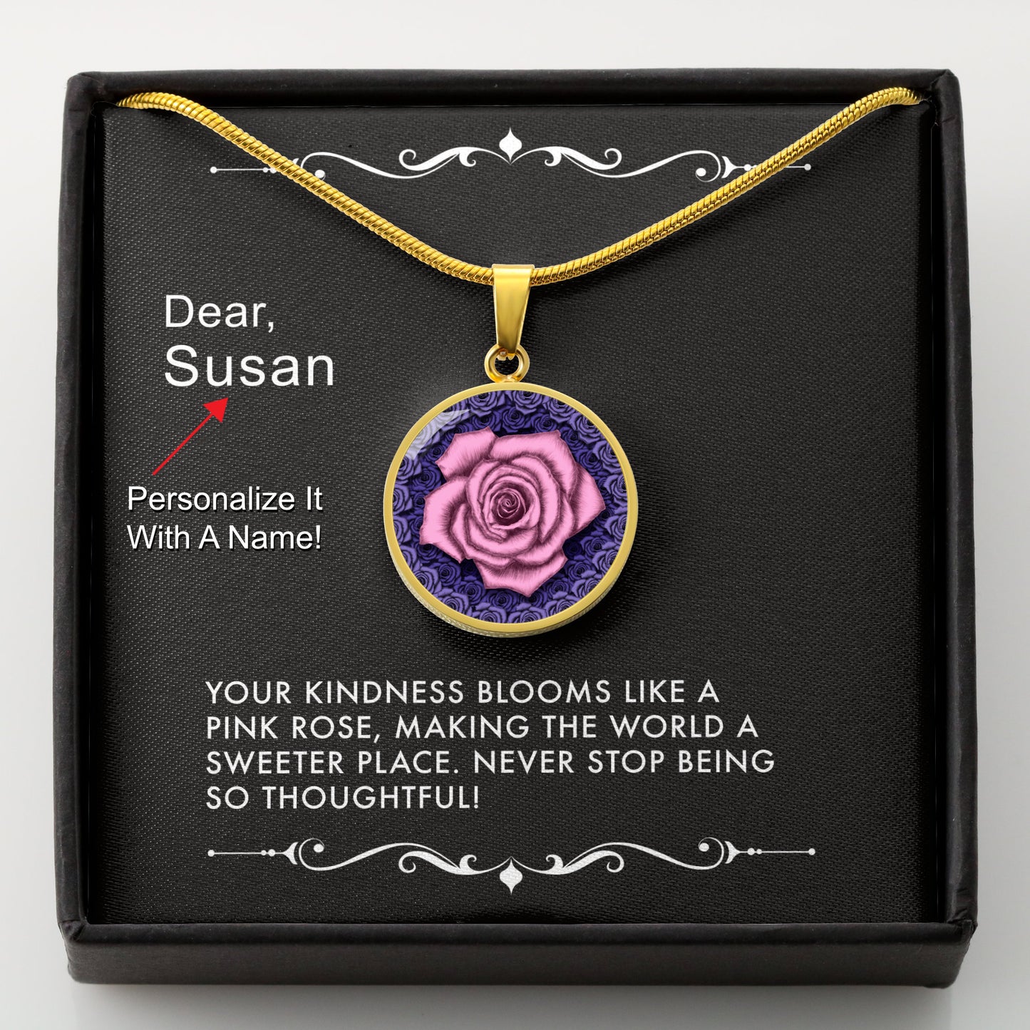 Gold necklace with a pink rose pendant in a box with a message card that can be personalized.
