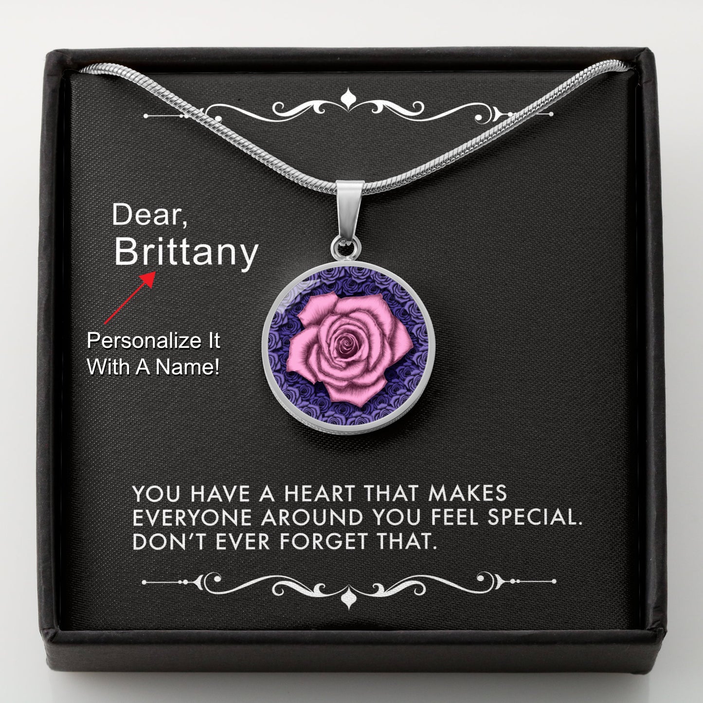 Silver necklace with a pink rose pendant in a box with a message card that can be personalized.