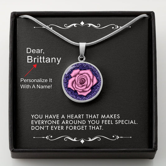 Silver necklace with a pink rose pendant in a box with a message card that can be personalized.