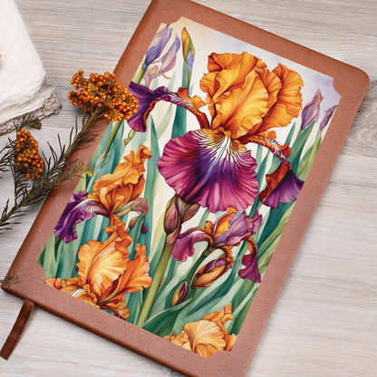 Notebook with a floral design on the cover, featuring orange and purple irises.