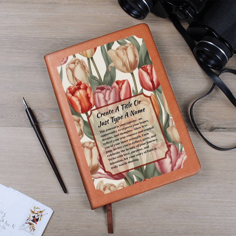 Vegan leather journal with a floral design on the cover, featuring text, red-orange, and pink tulips.