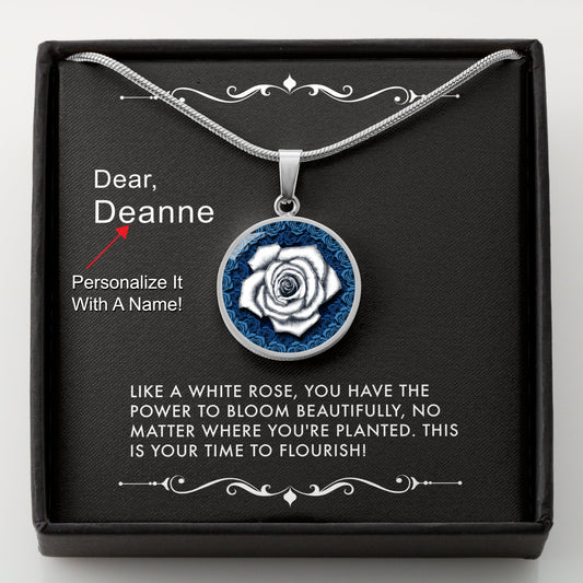 Silver necklace with a white rose pendant in a box with a message card that can be personalized.
