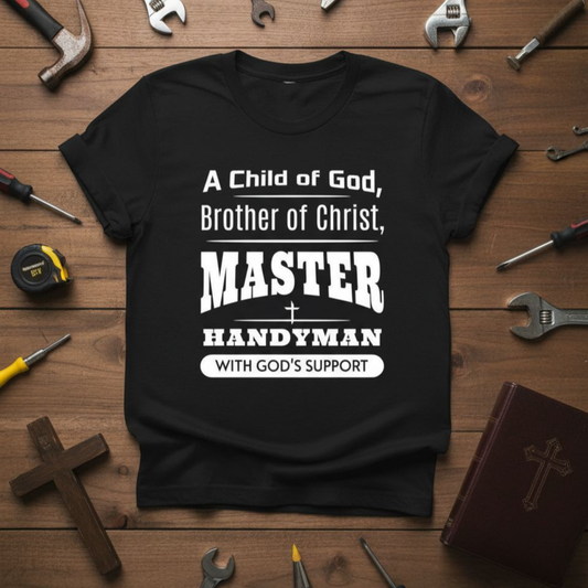 Black t-shirt with white text on a wooden background with tools and religious items.