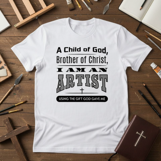 White t-shirt with text on a wooden table with art supplies