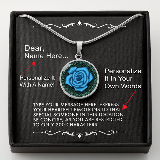 Silver necklace with a blue rose pendant in a box with a message card that can be personalized.