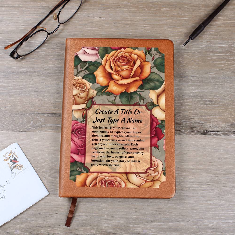 Vegan leather journal with a floral design on the cover, featuring text, orange, and pink roses.