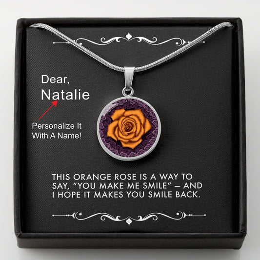 Silver necklace with an orange rose pendant in a box with a message card that can be personalized.