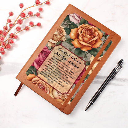 Vegan leather journal with a floral design on the cover, featuring text, orange, and pink roses.