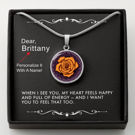Silver necklace with an orange rose pendant in a box with a message card that can be personalized.