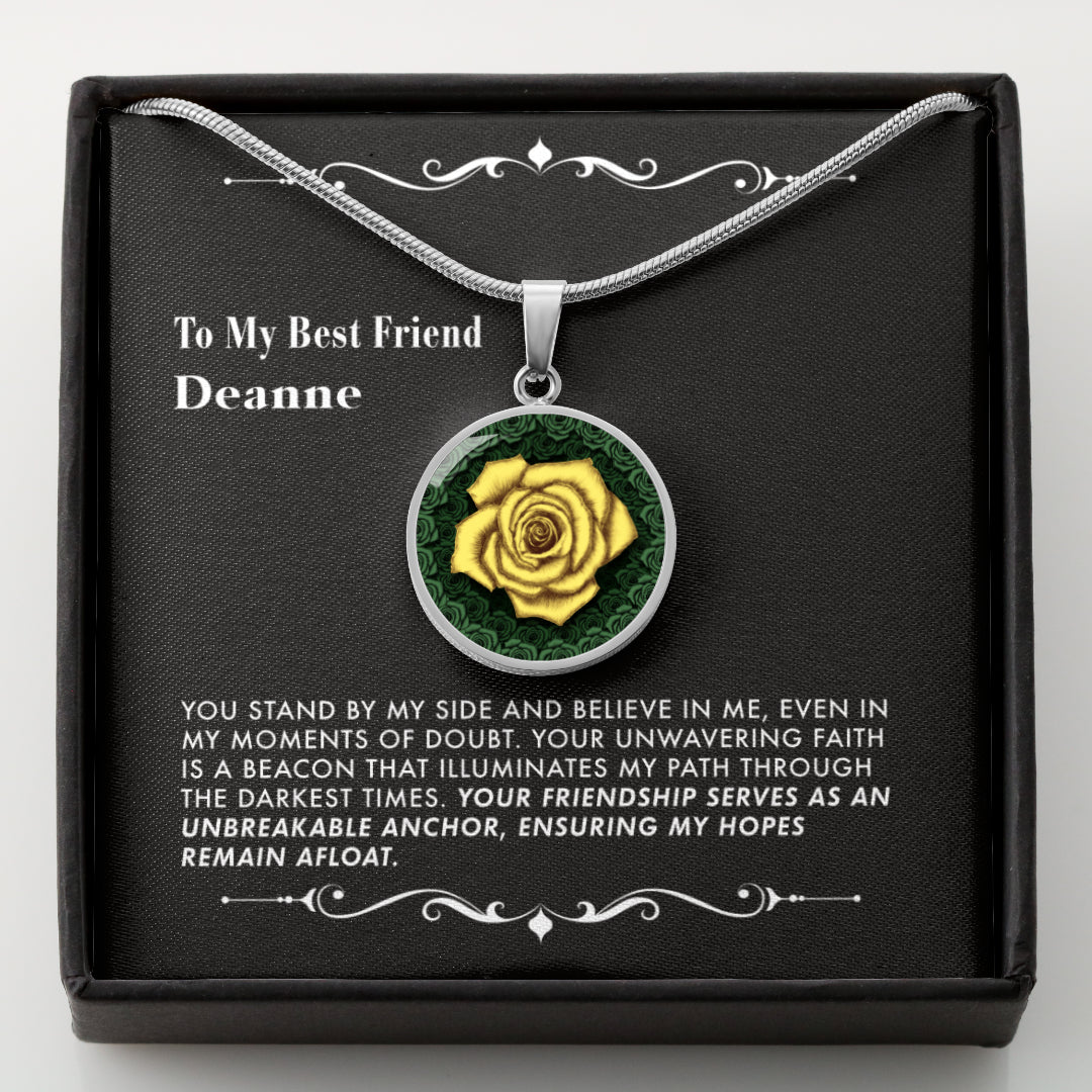 Necklace with a yellow rose pendant in a black gift box with a message card.