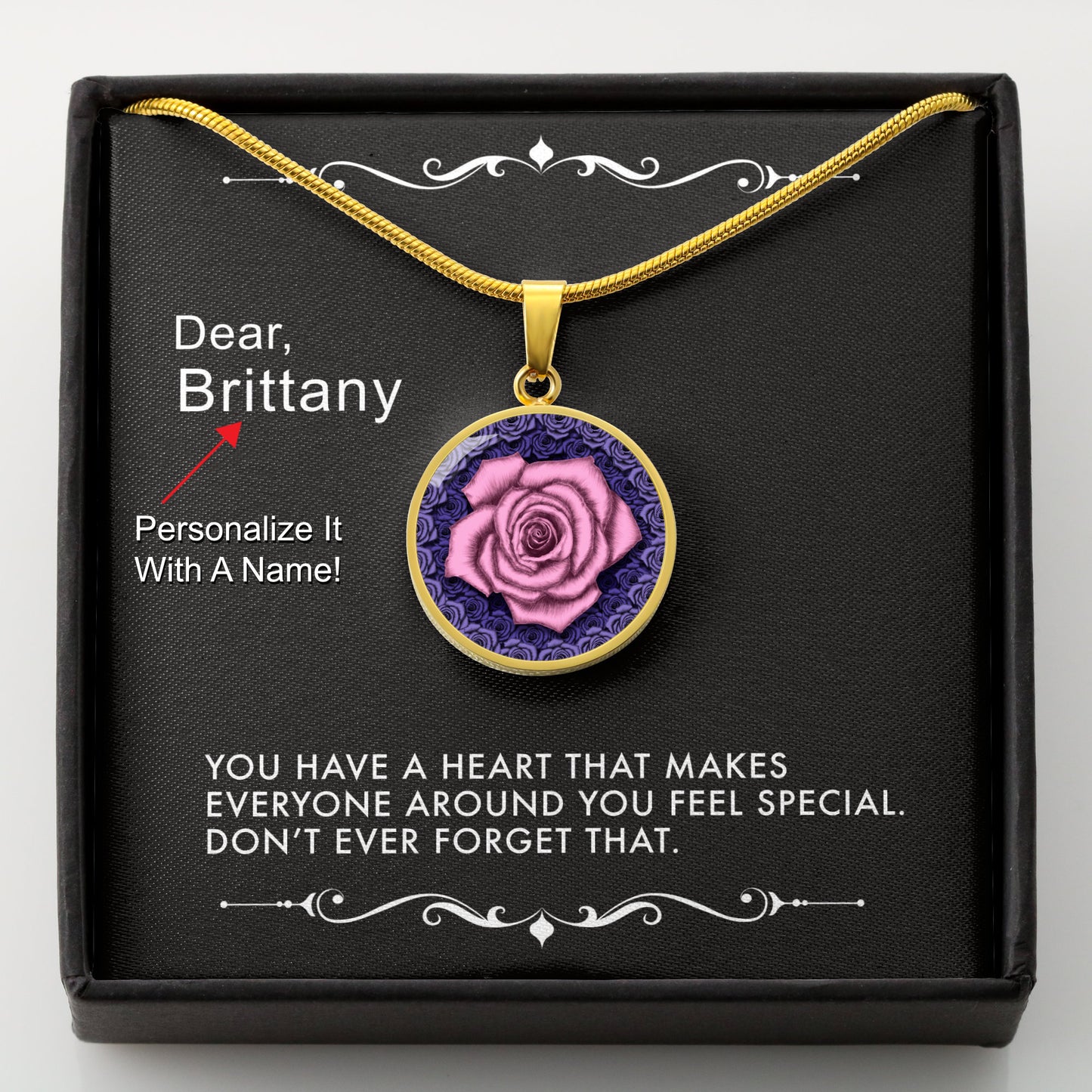 Gold necklace with a pink rose pendant in a box with a message card that can be personalized.
