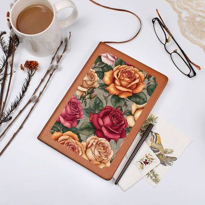 Vegan leather journal with a floral design on the cover, featuring orange and pink roses.