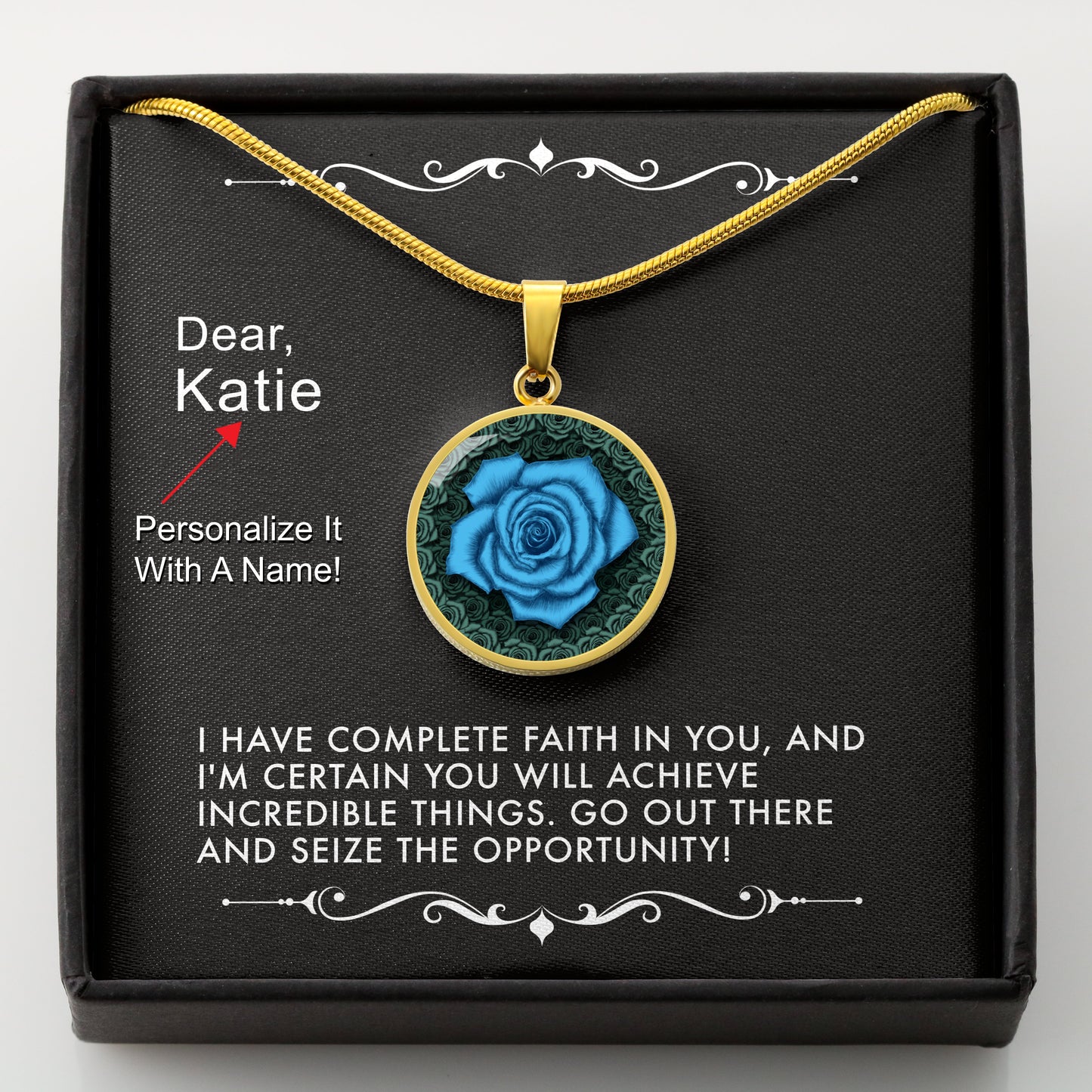 Gold necklace with a blue rose pendant in a box with a message card that can be personalized.