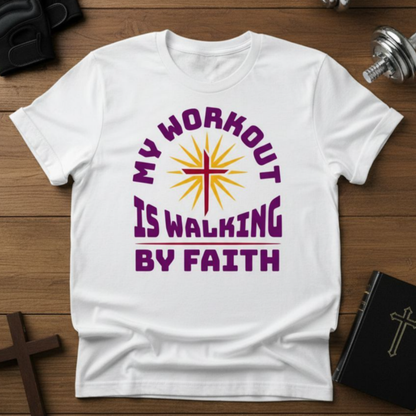 White t-shirt with 'My Workout is Walking by Faith' design on a wooden surface.