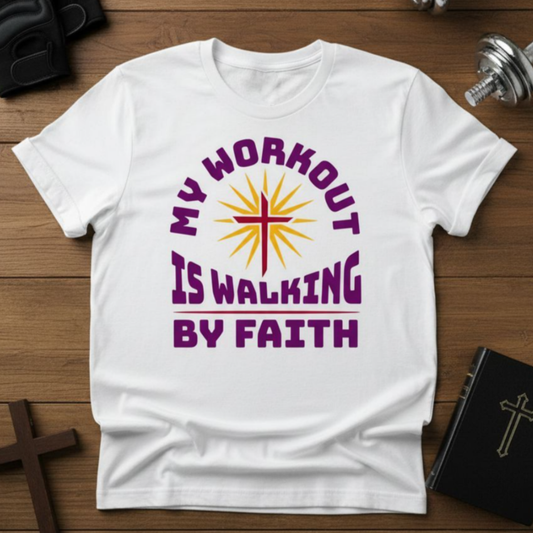 White t-shirt with 'My Workout is Walking by Faith' design on a wooden surface.